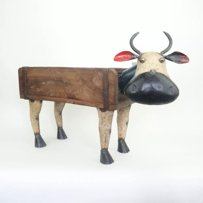 Steenmal met koe van oud blik