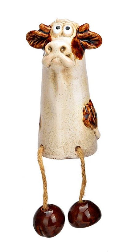 Beeldje koe met bungelbeentjes